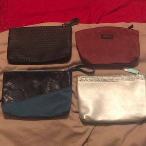 4 different color ipsy make up bags